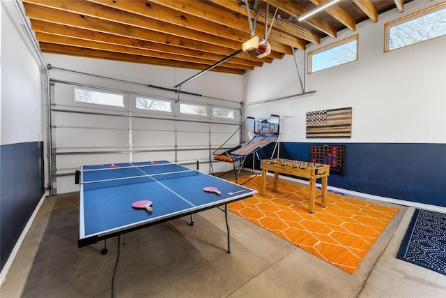 156 Palisade Dr, Gun Barrel City, TX 75156 - rec room with baseboards, beam ceiling, finished concrete flooring, and a garage