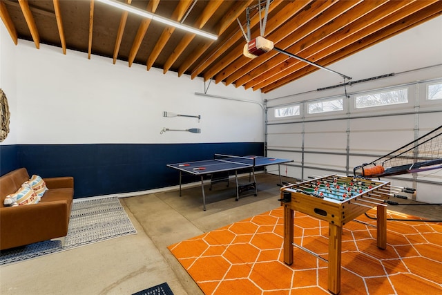156 Palisade Dr, Gun Barrel City, TX 75156 - rec room with a garage, lofted ceiling, concrete flooring, and a healthy amount of sunlight