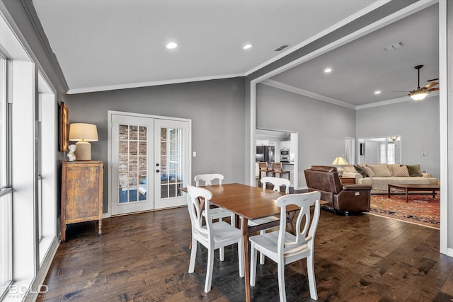 dining room featuring hardwood / wood-style floors, recessed lighting, vaulted ceiling, french doors, and crown molding