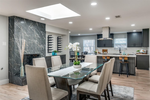 dining area with recessed lighting, visible vents, and light wood-type flooring