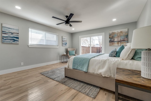 bedroom with a ceiling fan, recessed lighting, wood finished floors, and baseboards