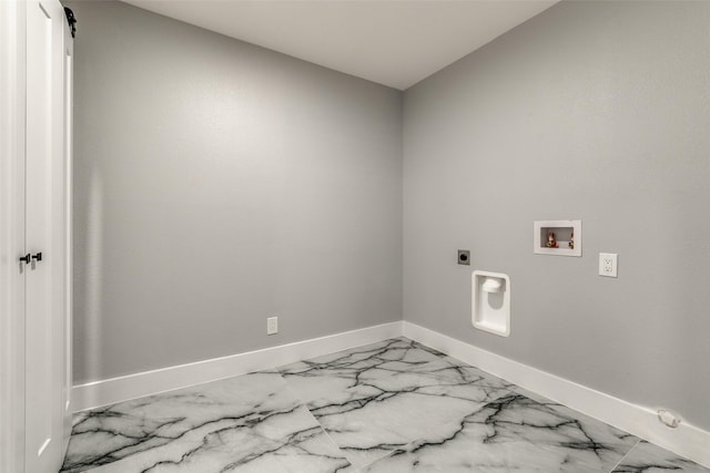 laundry area with laundry area, hookup for a washing machine, hookup for an electric dryer, and baseboards