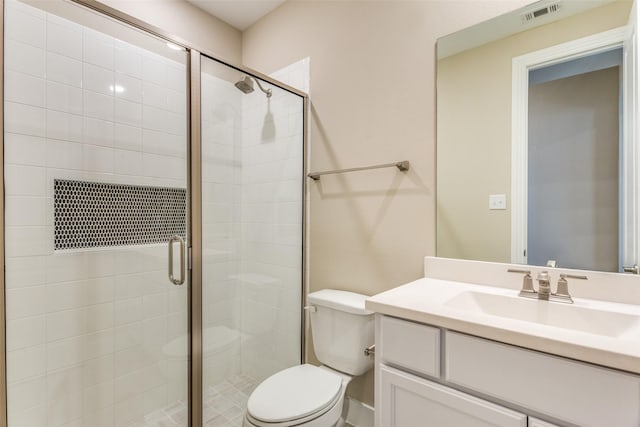 full bathroom with visible vents, a stall shower, toilet, and vanity