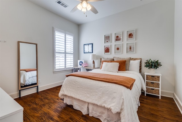 bedroom with visible vents, ceiling fan, dark wood-type flooring, and baseboards