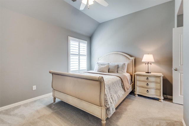 carpeted bedroom featuring baseboards, a ceiling fan, and vaulted ceiling