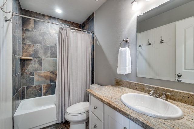 full bathroom with vanity, toilet, and shower / bath combo