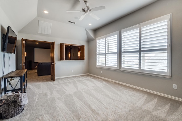 living area featuring recessed lighting, visible vents, baseboards, and light colored carpet