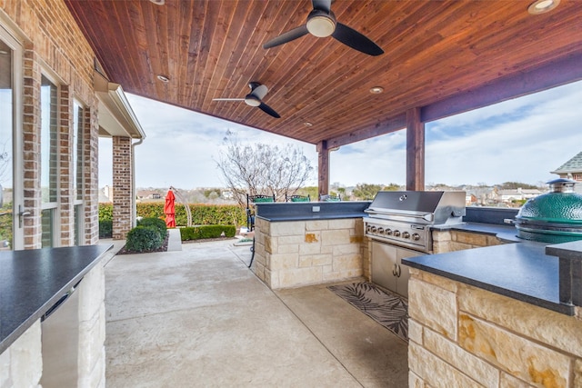 view of patio with ceiling fan, area for grilling, and grilling area