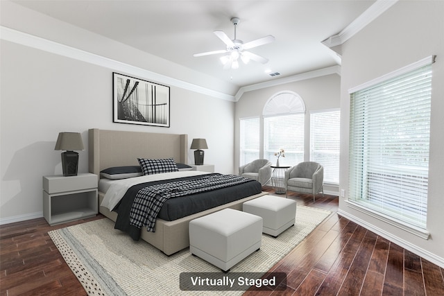 bedroom featuring a ceiling fan, wood finished floors, visible vents, baseboards, and crown molding