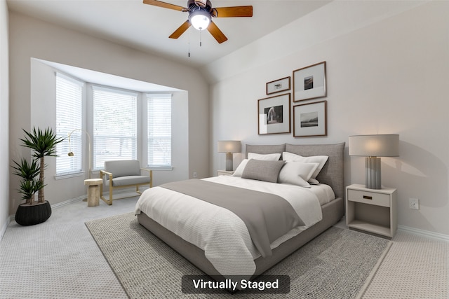 bedroom with ceiling fan, baseboards, and carpet floors