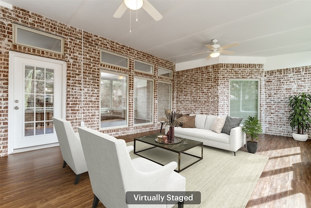 sunroom featuring a ceiling fan