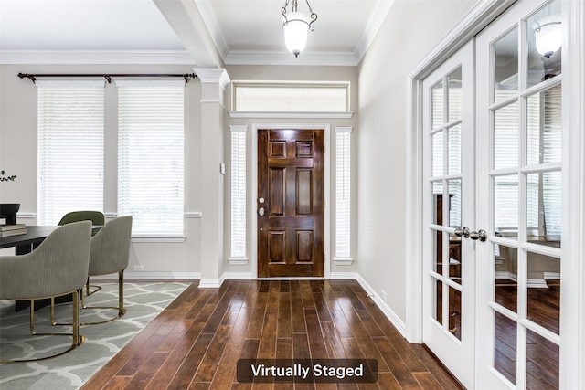 entryway with baseboards, dark wood-type flooring, and crown molding