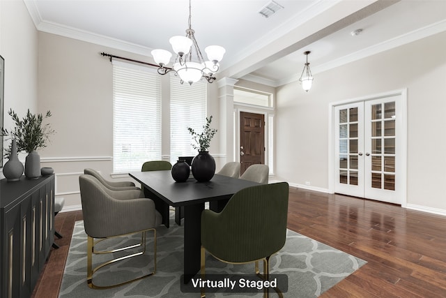 dining space with visible vents, french doors, crown molding, and wood finished floors