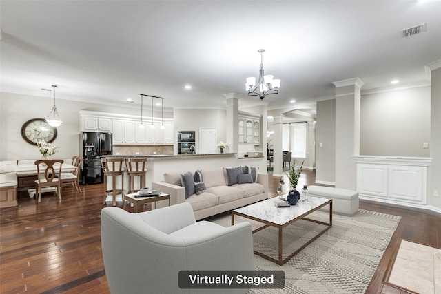 living room with visible vents, recessed lighting, crown molding, decorative columns, and dark wood-style flooring