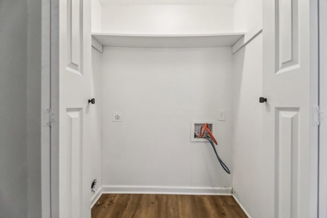 laundry area featuring baseboards, washer hookup, dark wood-style floors, and laundry area