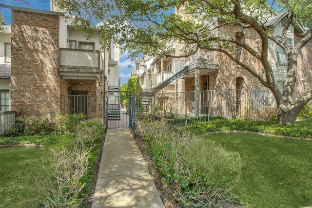 view of building exterior featuring a fenced front yard