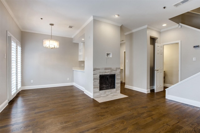 unfurnished living room featuring visible vents, baseboards, and wood finished floors