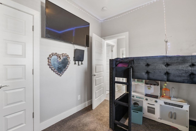 carpeted bedroom with baseboards