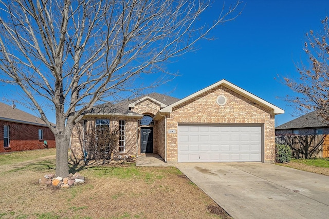 ranch-style home with brick siding, an attached garage, a front lawn, fence, and driveway