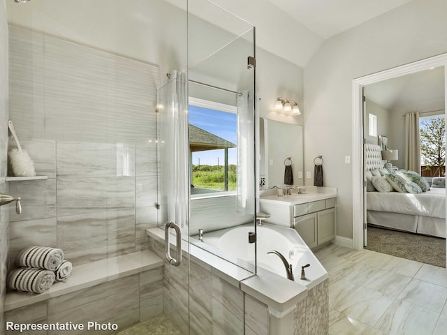 bathroom featuring a shower stall, lofted ceiling, a bath, marble finish floor, and ensuite bath