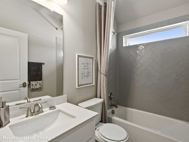 bathroom with vanity, shower / bath combination with curtain, and toilet