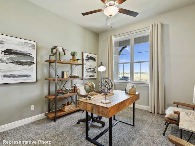 office space featuring baseboards, carpet floors, and a ceiling fan