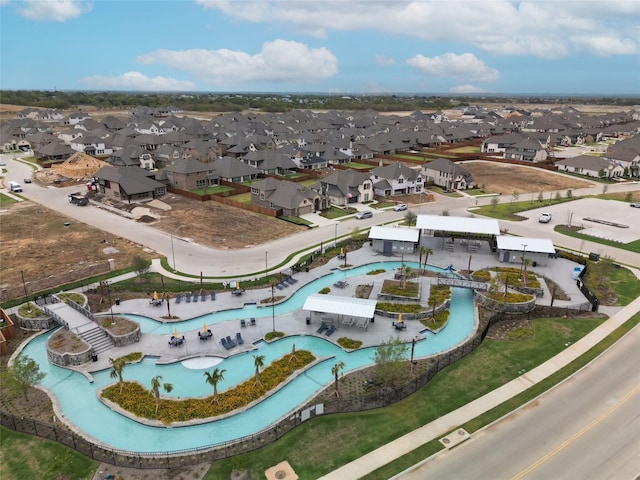 birds eye view of property with a residential view