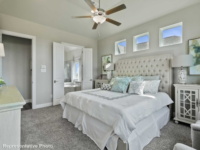 carpeted bedroom with multiple windows, connected bathroom, baseboards, and ceiling fan