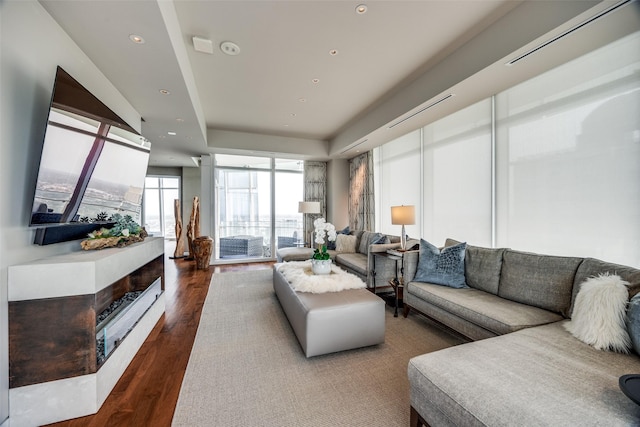 1918 Olive St Unit 3202, Dallas, TX 75201 - living area with a raised ceiling, recessed lighting, and wood finished floors