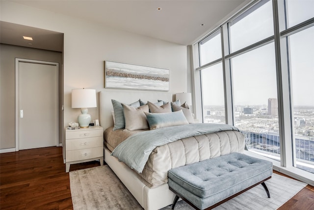 1918 Olive St Unit 3202, Dallas, TX 75201 - bedroom with floor to ceiling windows and wood finished floors