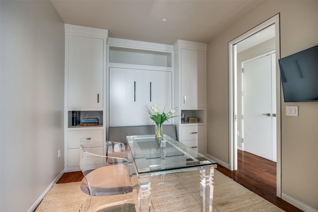 1918 Olive St Unit 3202, Dallas, TX 75201 - kitchen featuring dark wood finished floors, white cabinets, and baseboards