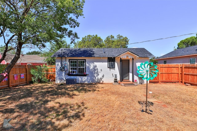 view of front of house featuring central AC unit, a fenced backyard, and entry steps