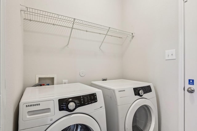 laundry area with laundry area and washing machine and clothes dryer