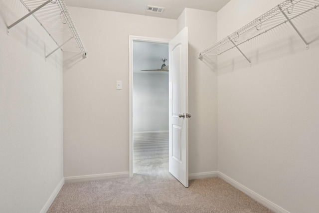 spacious closet with visible vents and carpet