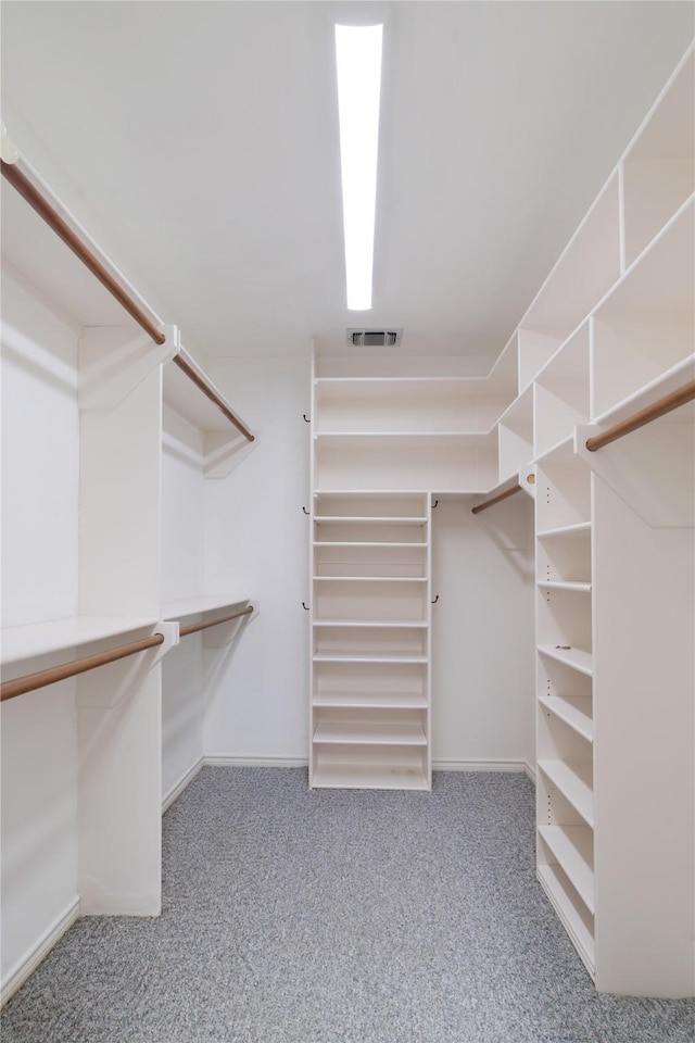 walk in closet with carpet flooring and visible vents