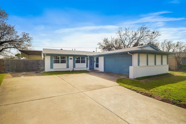 ranch-style home with a front yard, fence, concrete driveway, a garage, and brick siding