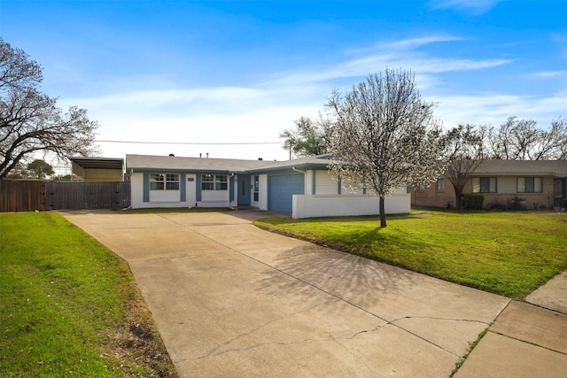 ranch-style home featuring a front lawn, a gate, fence, concrete driveway, and a garage