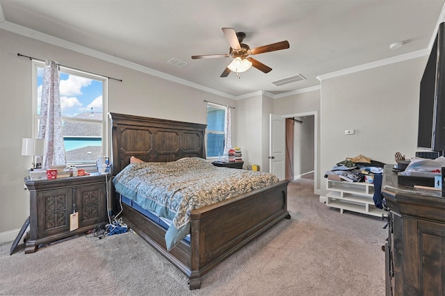 bedroom with visible vents, ornamental molding, carpet, baseboards, and ceiling fan