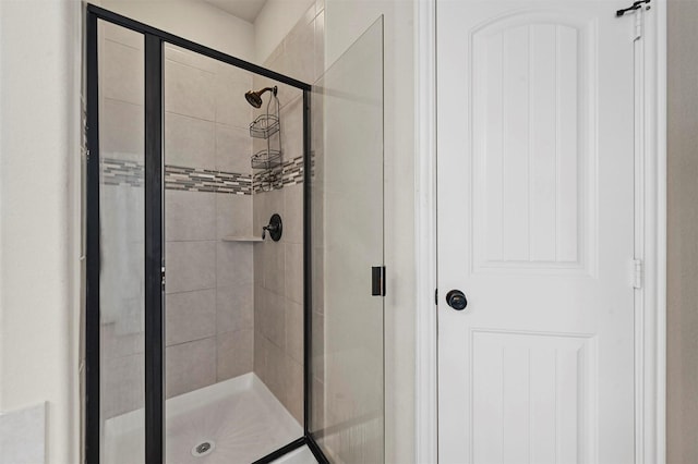 full bath with a shower stall