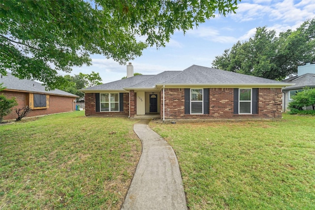 ranch-style house with a front yard, brick siding, roof with shingles, and a chimney