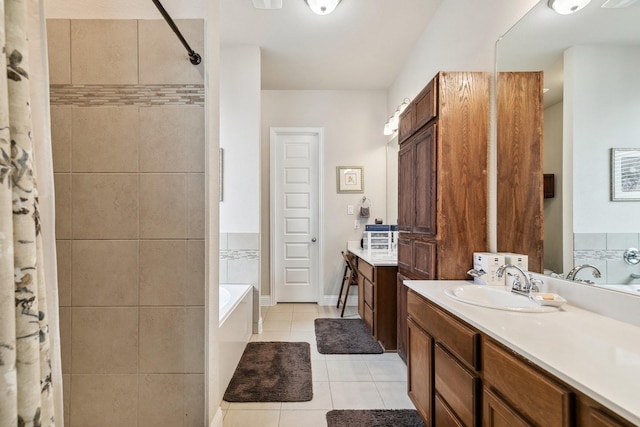 full bath with tile patterned flooring, a bath, vanity, and a tile shower