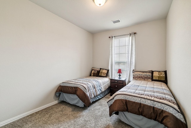 bedroom with visible vents, carpet flooring, and baseboards