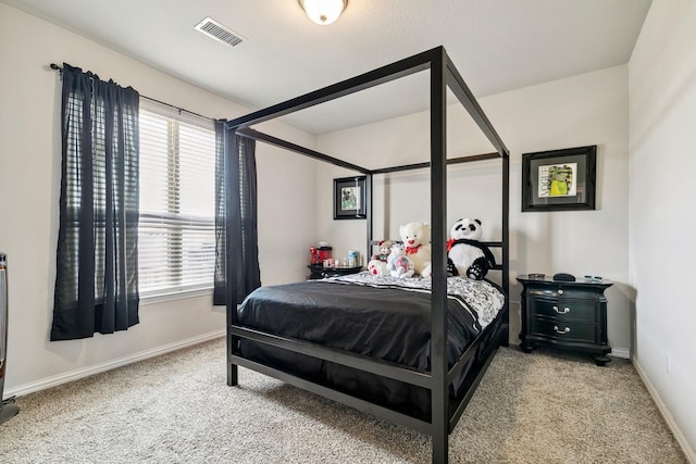 bedroom featuring carpet flooring, baseboards, and visible vents