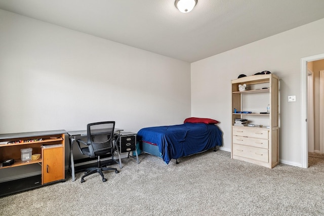 bedroom with baseboards and carpet flooring