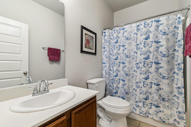 full bathroom featuring vanity, toilet, a shower with curtain, and tile patterned flooring