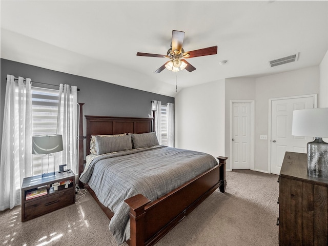 bedroom with visible vents, lofted ceiling, a ceiling fan, carpet, and baseboards