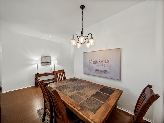 dining room with wood-type flooring, a chandelier, baseboards, and recessed lighting