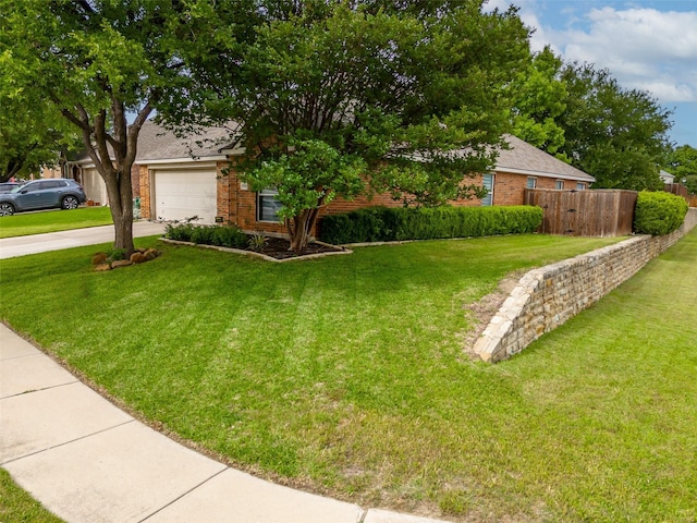 view of property hidden behind natural elements with concrete driveway and brick siding