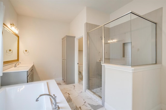 full bathroom with vanity, a bath, a shower stall, toilet, and marble finish floor