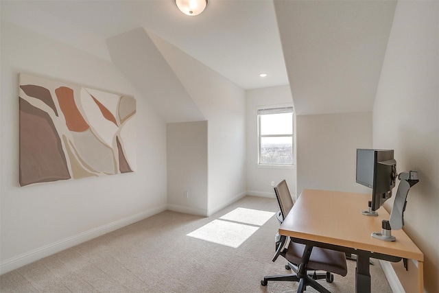 home office featuring lofted ceiling, baseboards, and carpet floors